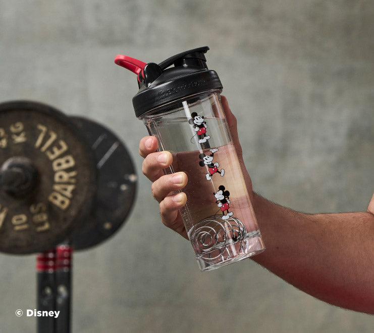 pro-series-p6 Mickey_Mouse_Protein_Shaker_Bottle_Being_Held_In_the_Gym.jpg